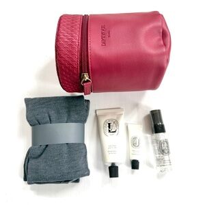 Diptyque Paris dark red round cosmetics case for Qatar Airways Business Class
